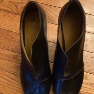 Black Nine West peep toe shoes.